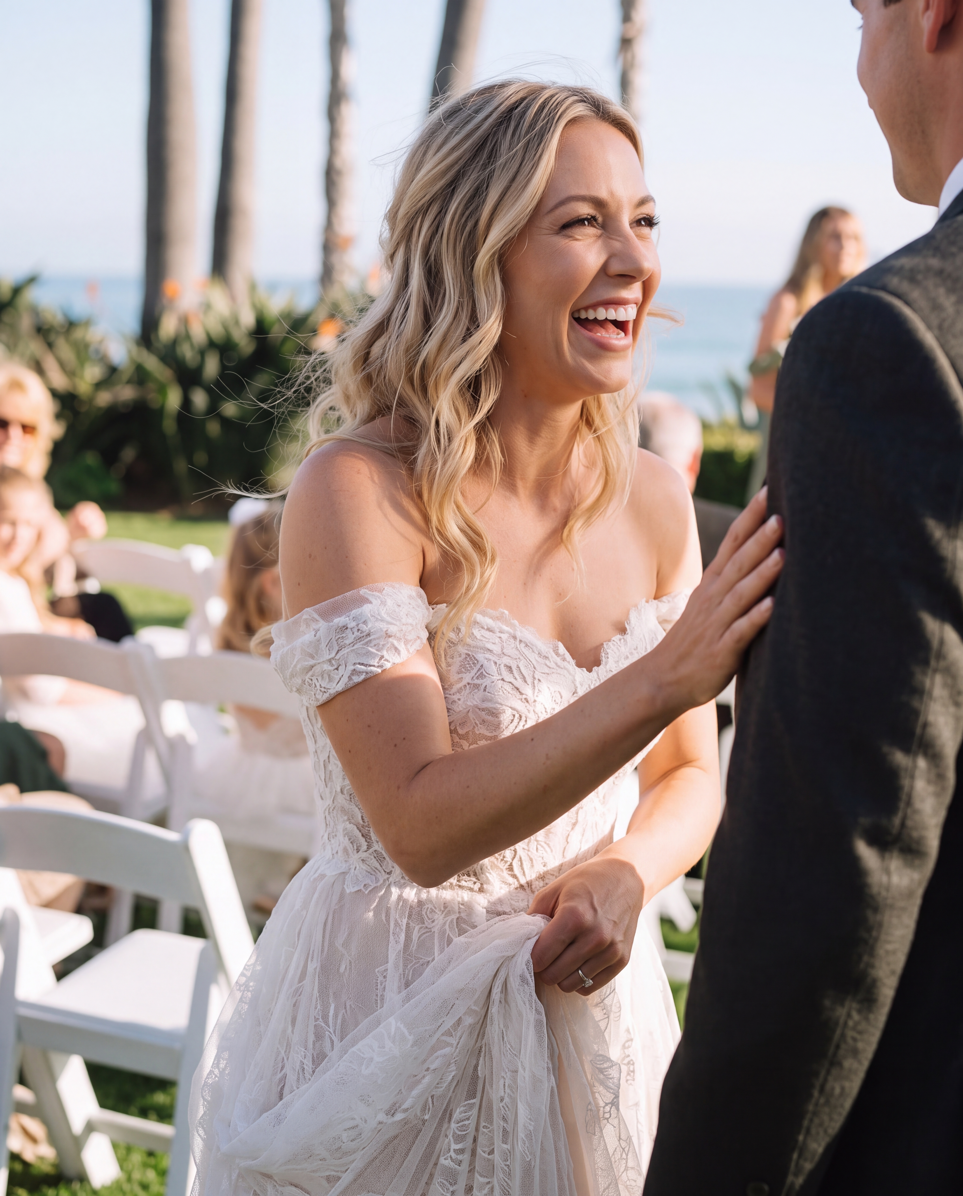 Bride and groom sharing an emotional ceremony-adjacent moment with natural fabric contact.